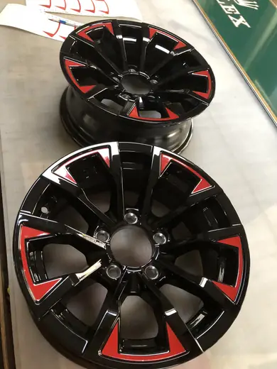 Black wheel with red accent decals
