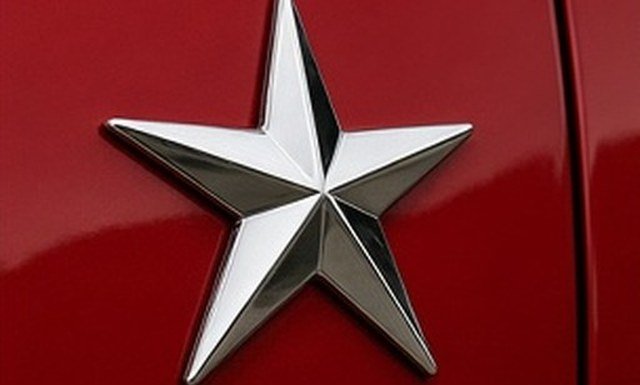 Stock adhesive chrome emblem mounted as a decorative badge